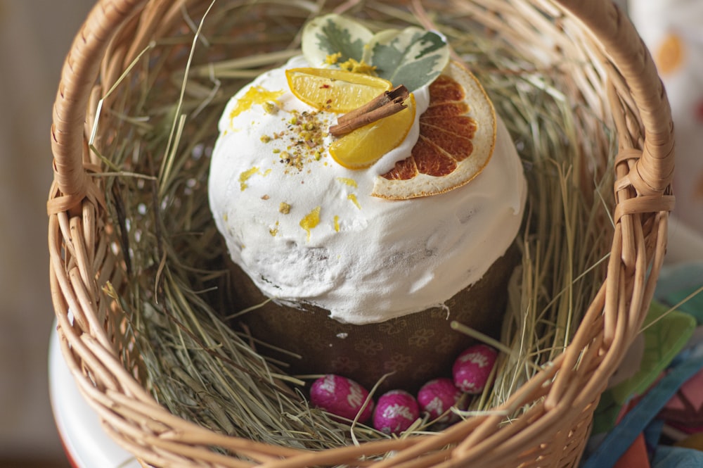 white and brown cake on brown woven basket