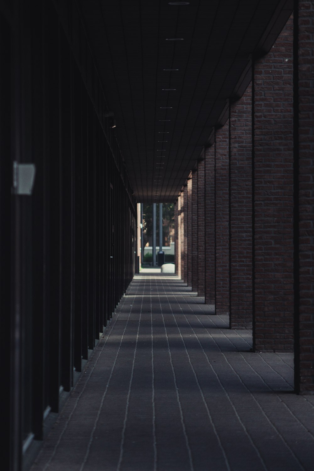 person walking on hallway during daytime