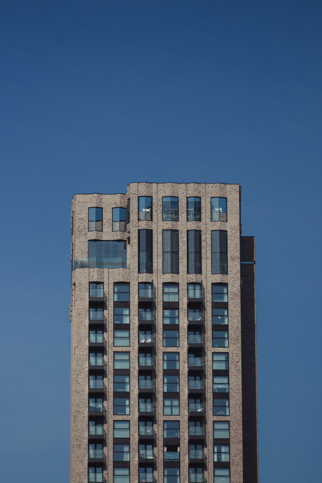 brown concrete building under blue sky during daytime