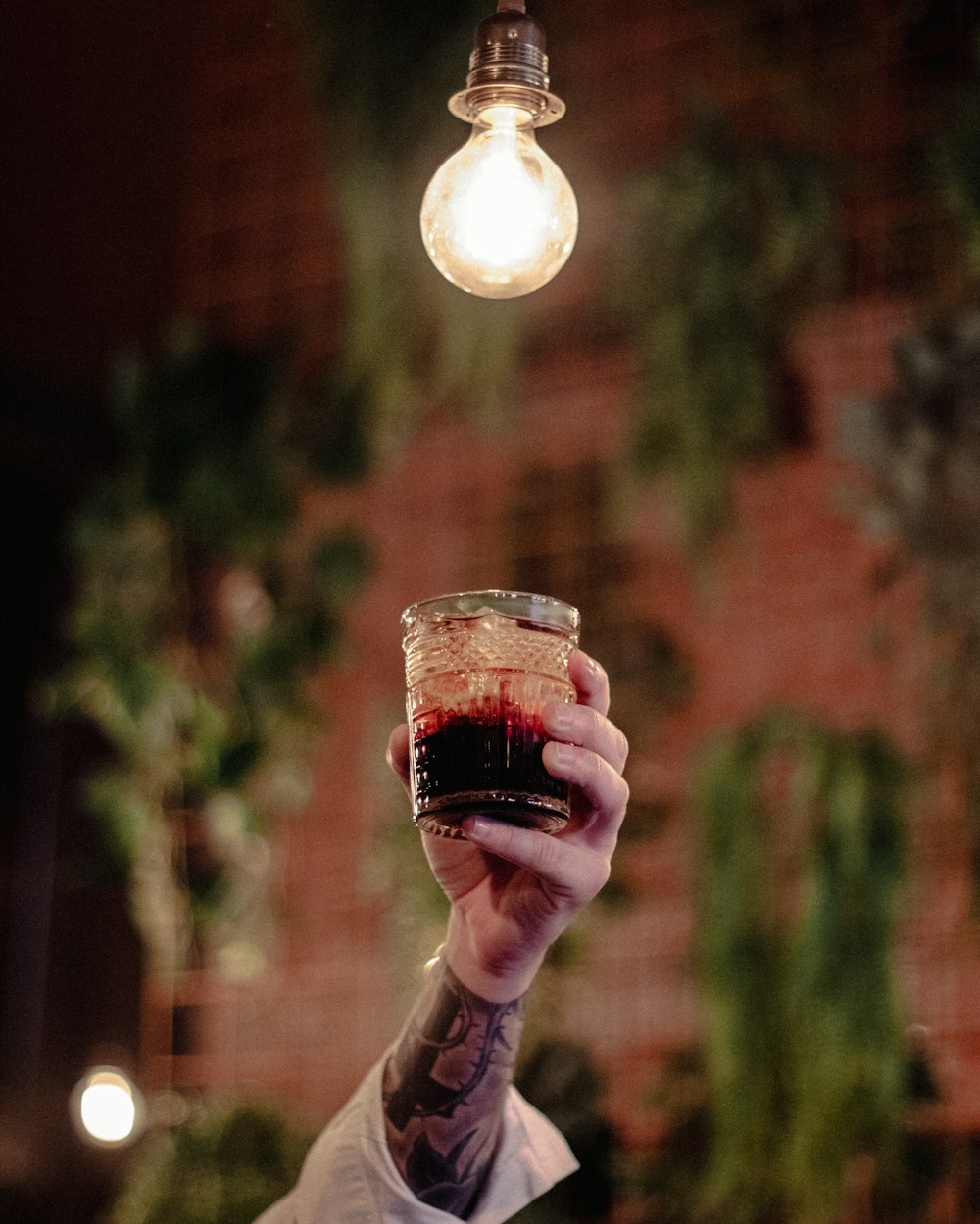 person holding clear glass ball