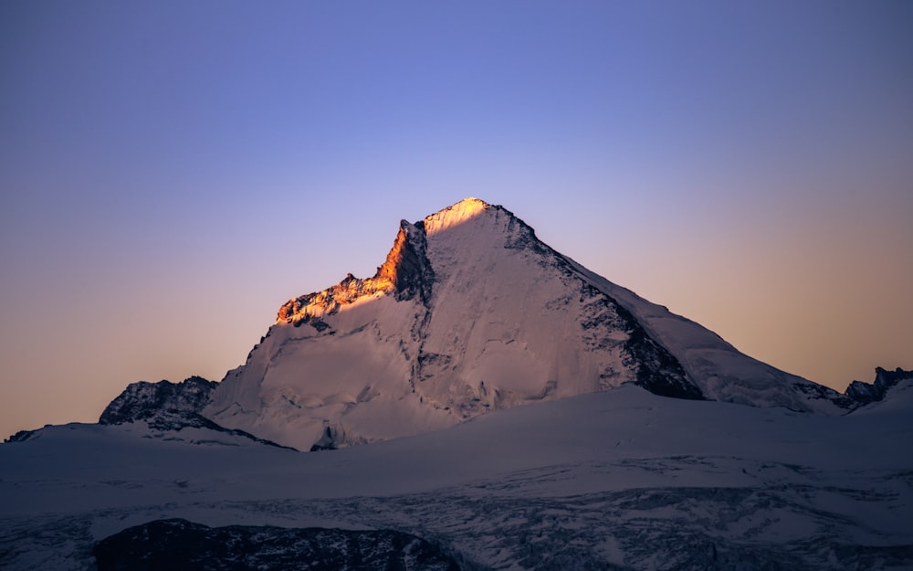 snow covered mountain during daytime