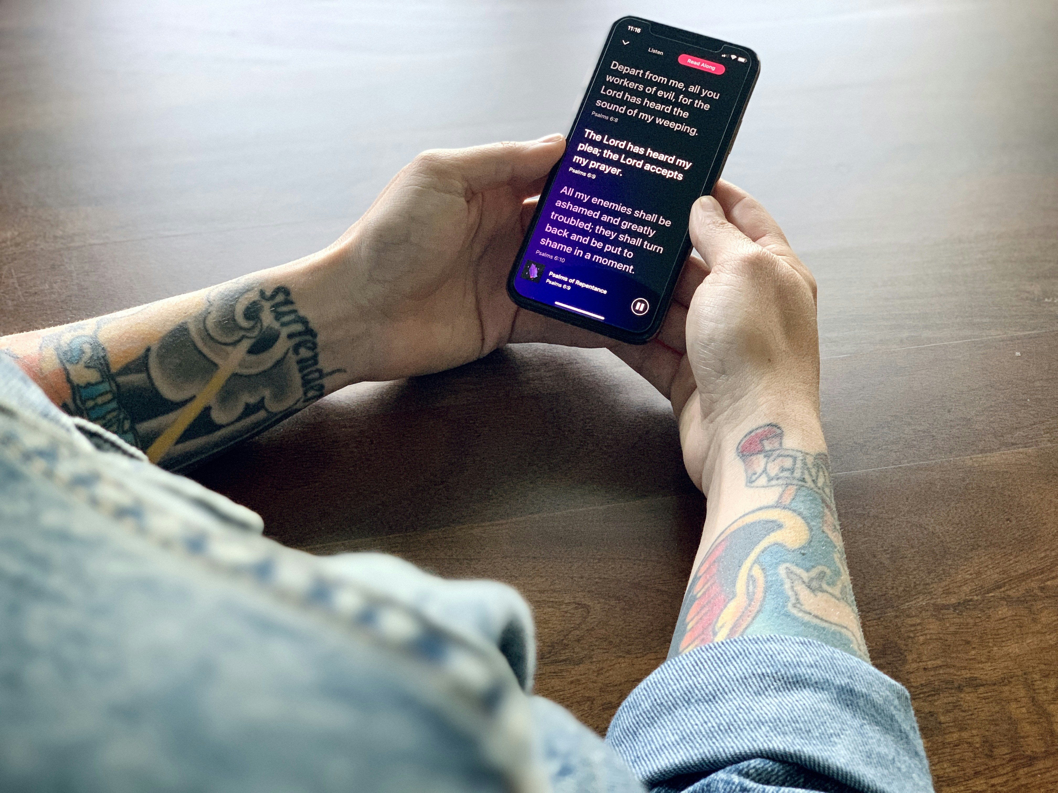 Man reading Bible on iPhone