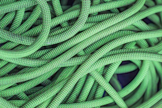 green rope on blue textile
