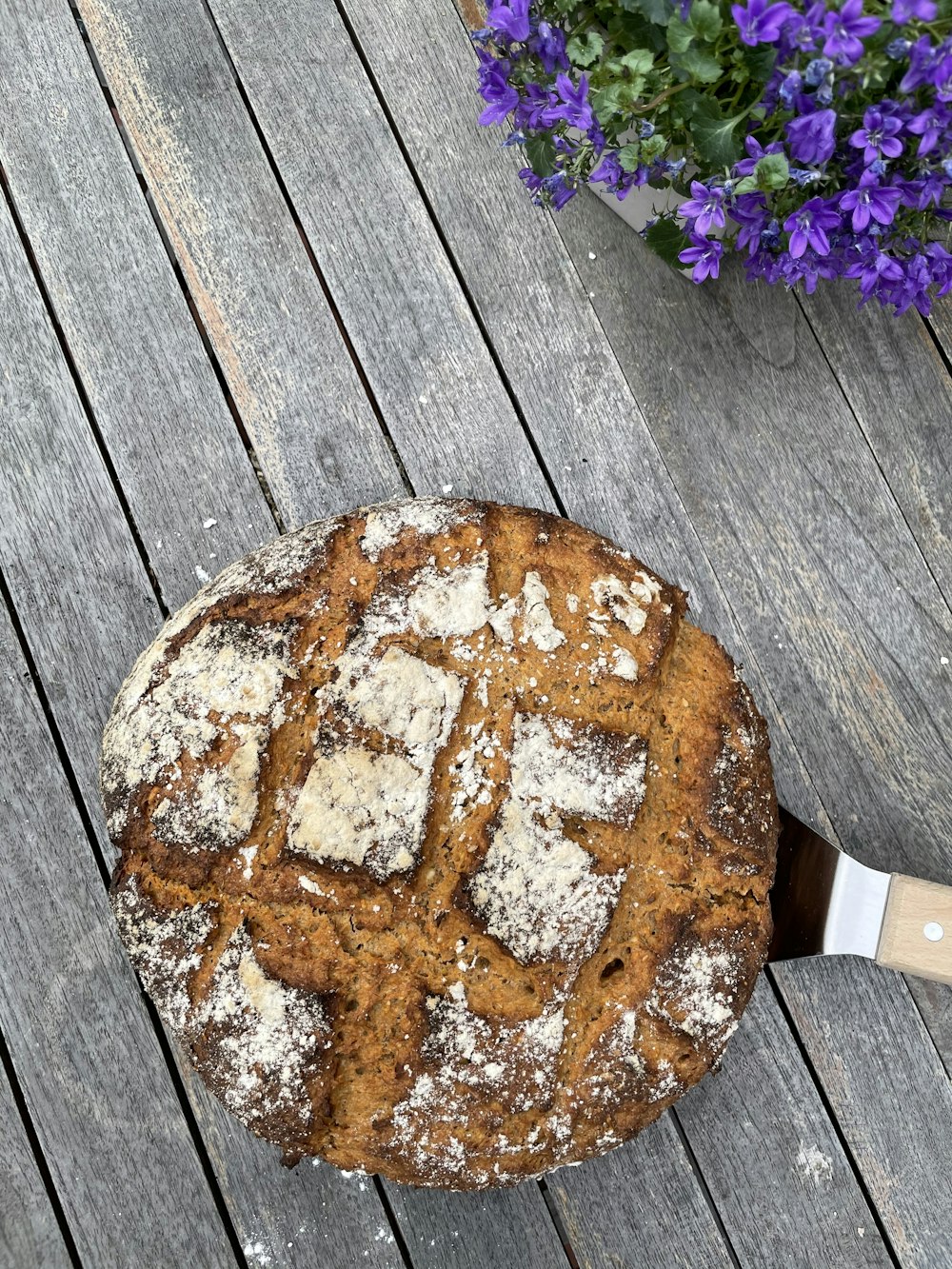 brown round bread on brown wooden table