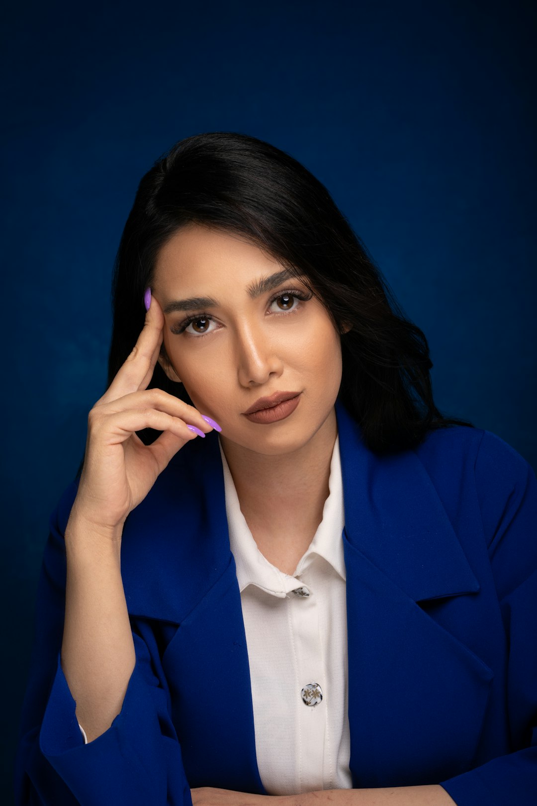 woman in blue blazer smiling