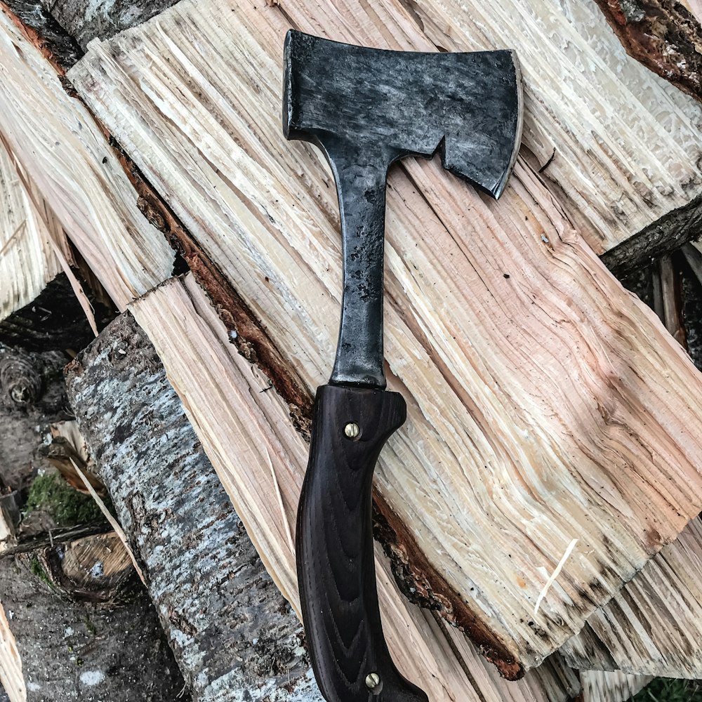 black handle knife on brown wood