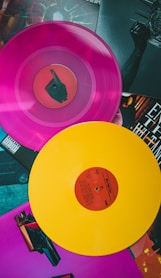 purple vinyl record on black and white table