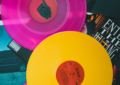 purple vinyl record on black and white table