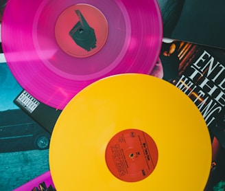 purple vinyl record on black and white table