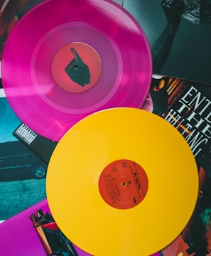 purple vinyl record on black and white table