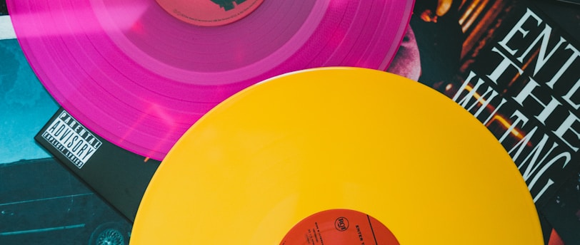 purple vinyl record on black and white table