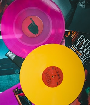 purple vinyl record on black and white table