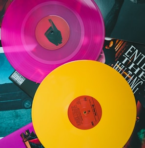 purple vinyl record on black and white table