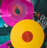 purple vinyl record on black and white table