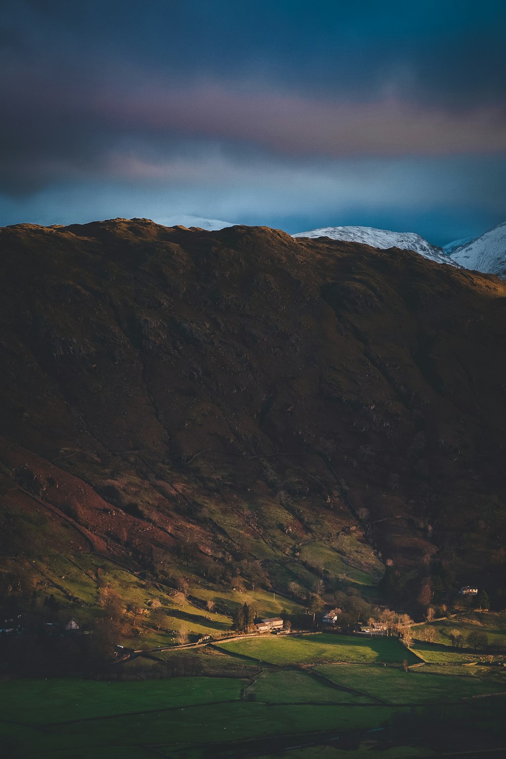 brown and gray mountains under gray sky