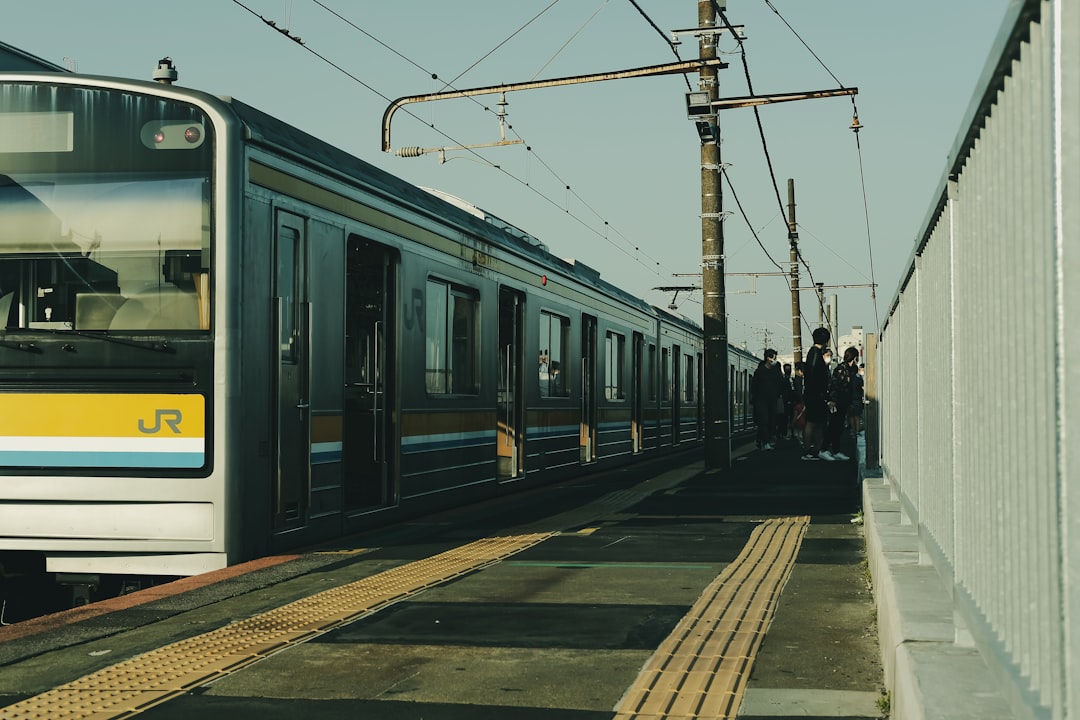 white and black train on train station during daytime