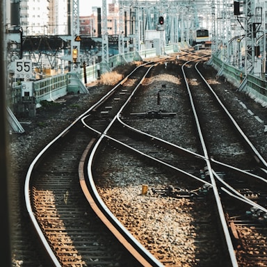 train rail tracks near buildings during daytime