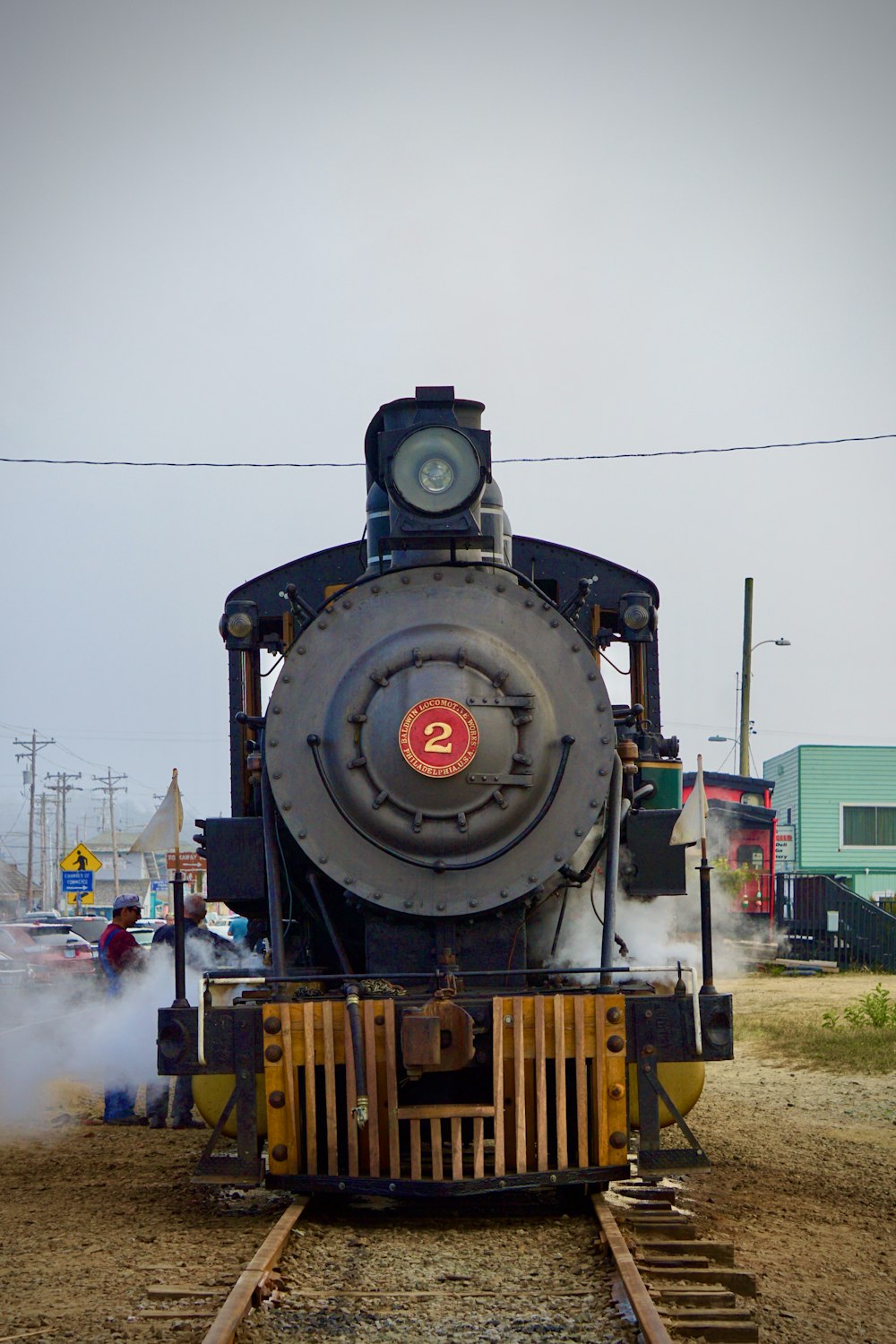 black and green train on rail during daytime