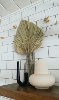 white and brown hand fan