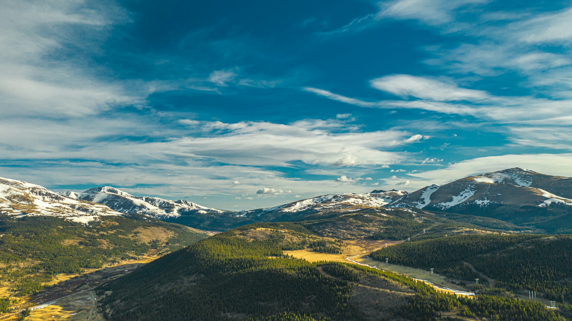 green and brown mountains under blue sky and white clouds during daytime