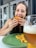A happy customer enjoying a delicious meal at home.