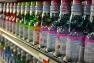 pink and blue labeled bottles