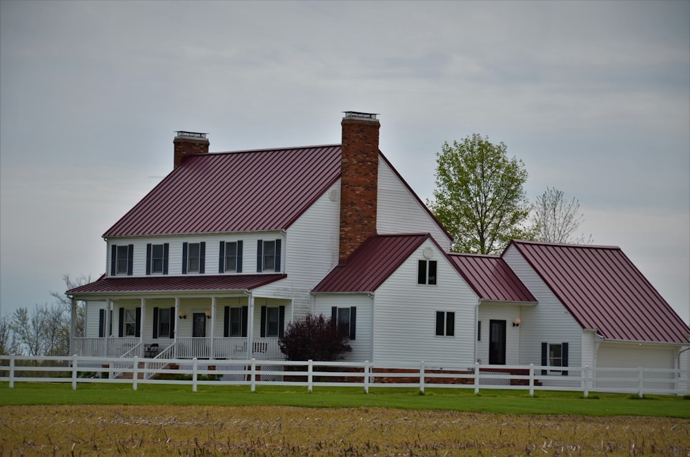 white and brown house under white sky during daytime