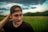 man in black crew neck shirt wearing black knit cap