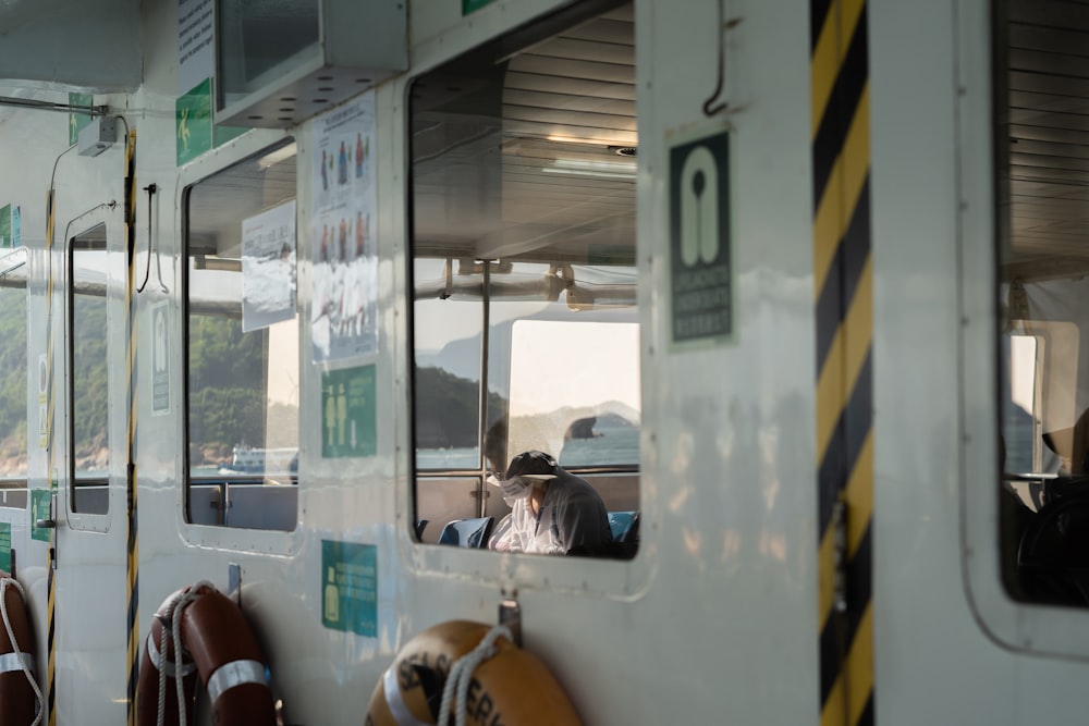 people sitting inside train during daytime