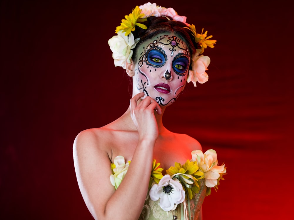 woman with white and pink flower on her face