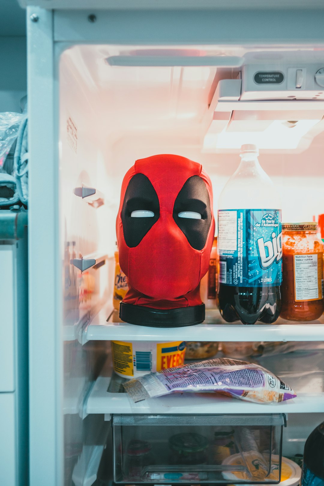 red and black mask in refrigerator