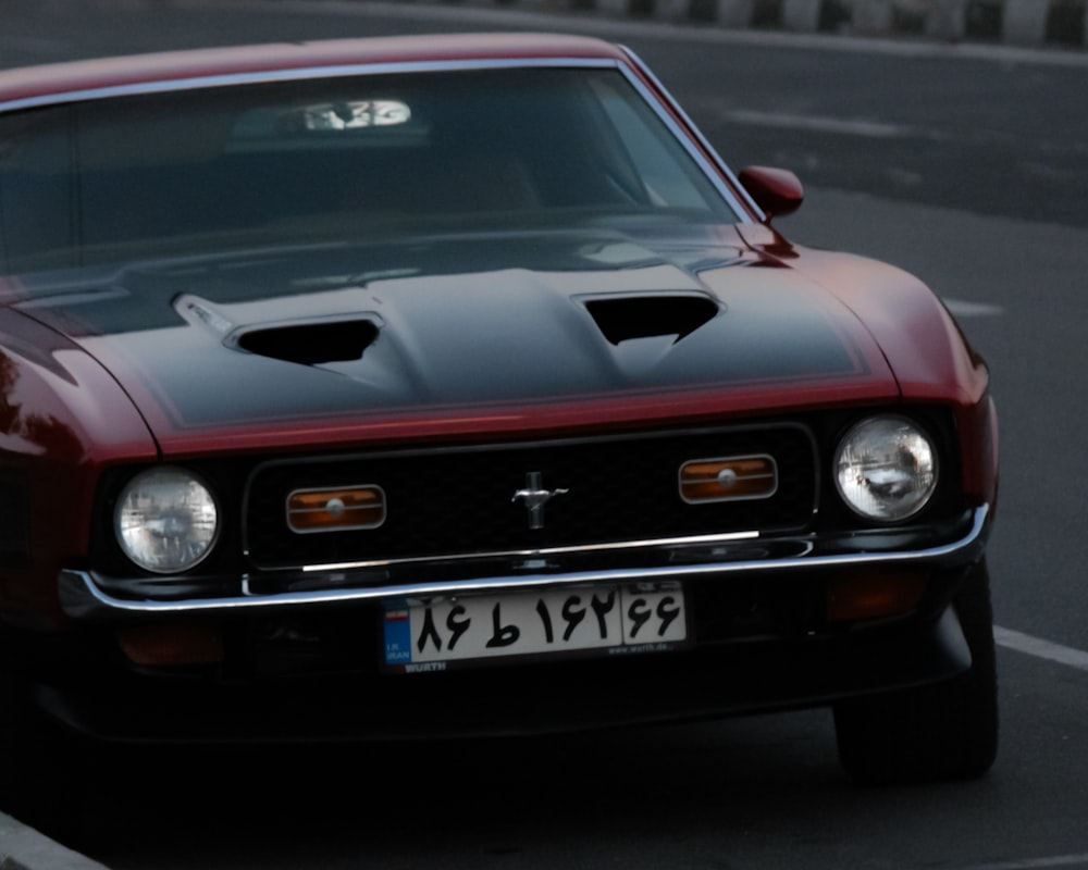 red and black chevrolet camaro