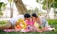 A happy family enjoying a picnic in a park, symbolizing financial security and togetherness.