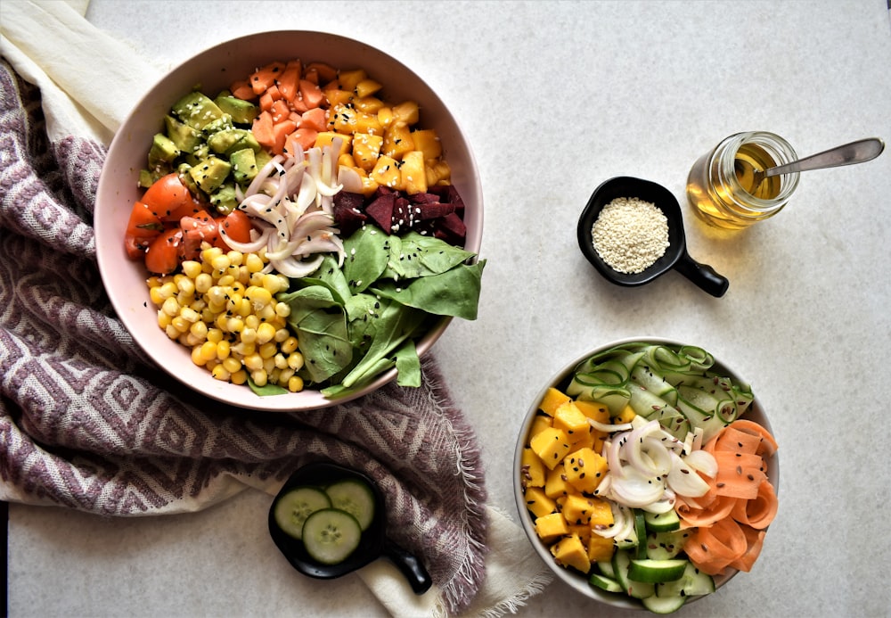 sliced cucumber and carrots in white ceramic bowl