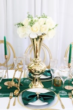 white roses in clear glass vase