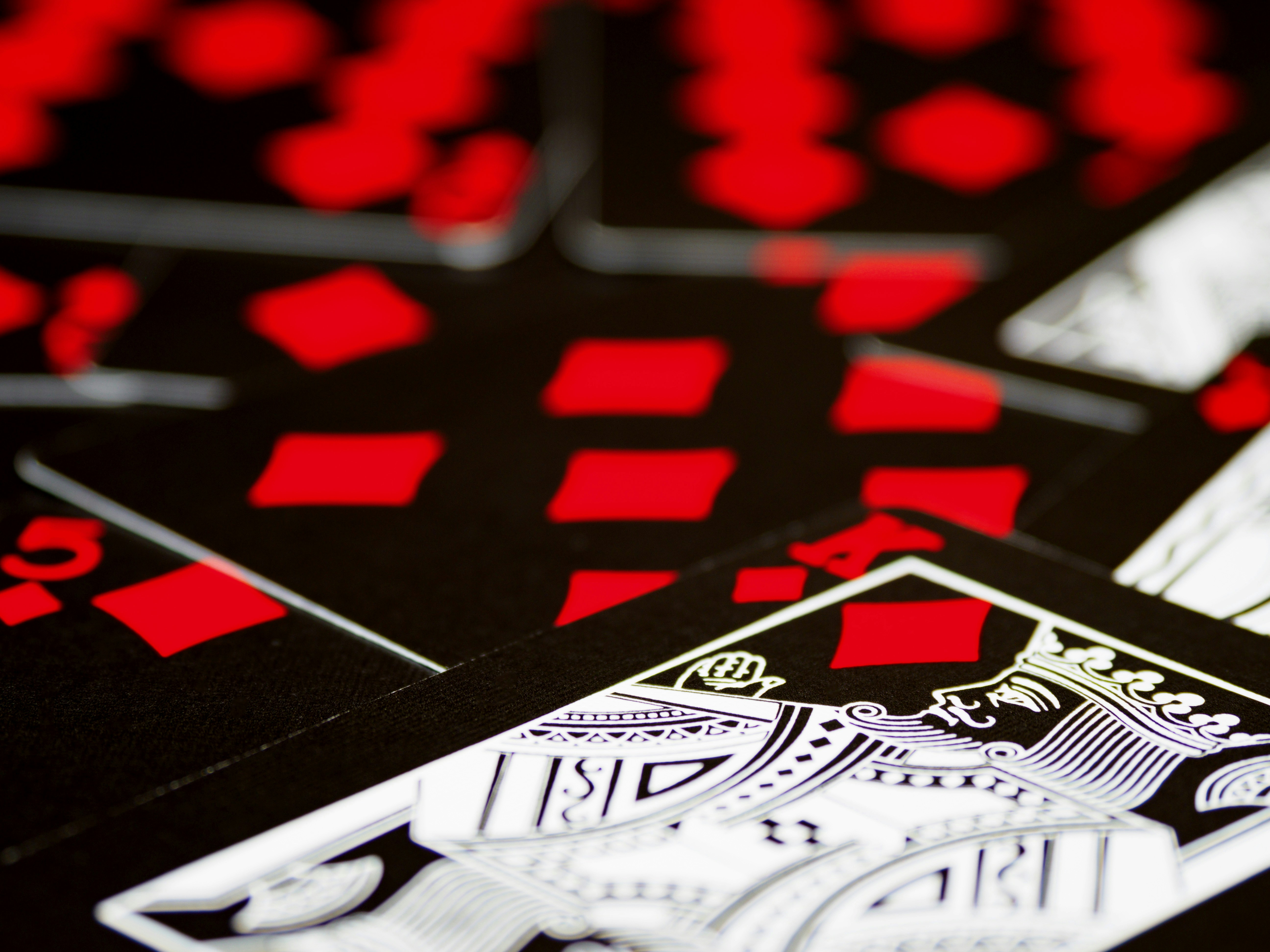 cards, playing cards, gambling, close up, bokeh, wood background, product shot, focus, deal,