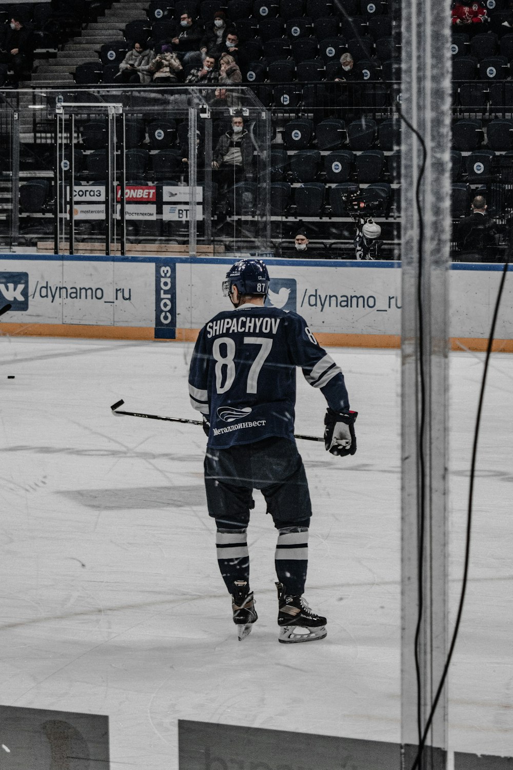 man in black ice hockey jersey playing hockey