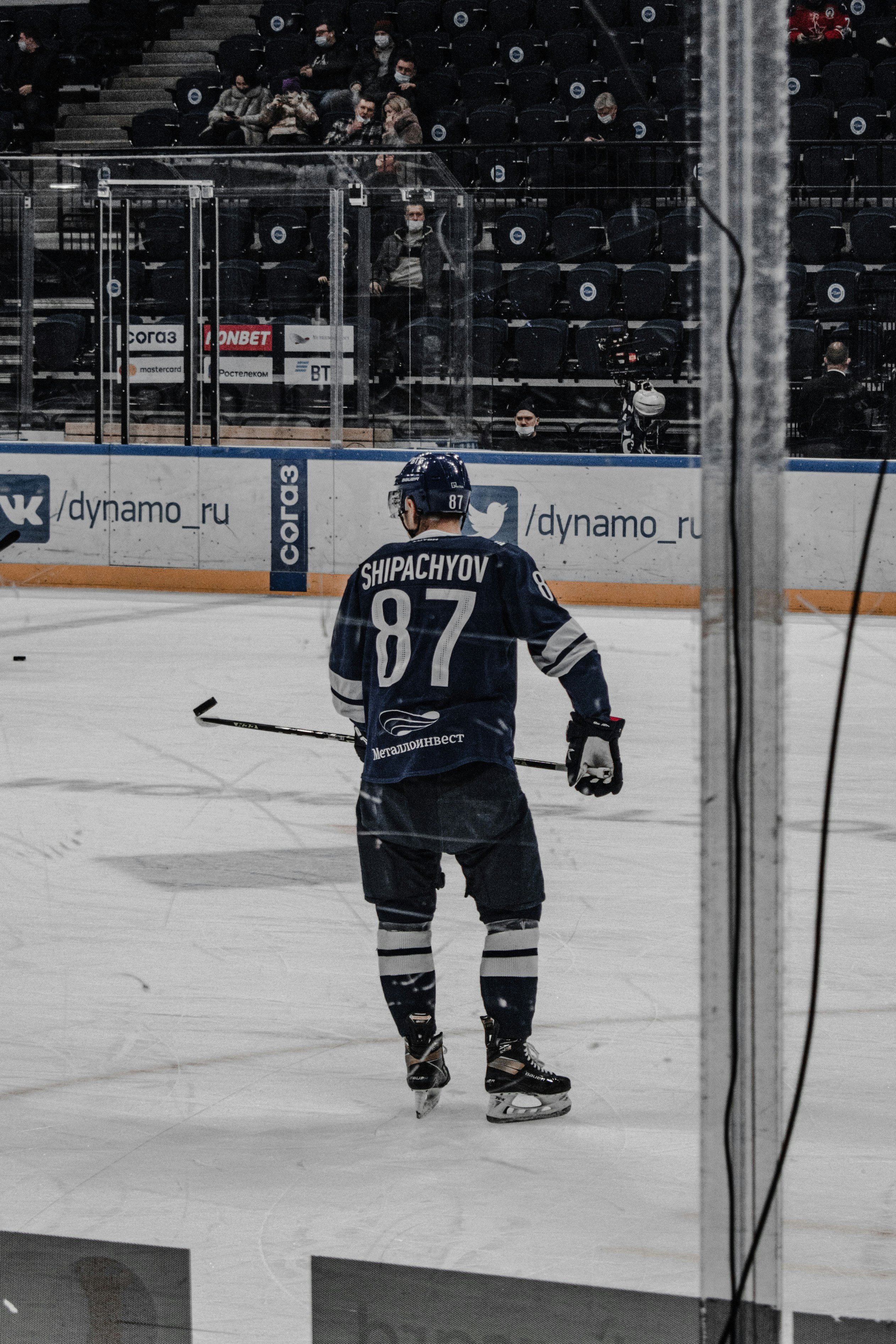 man in black ice hockey jersey playing hockey