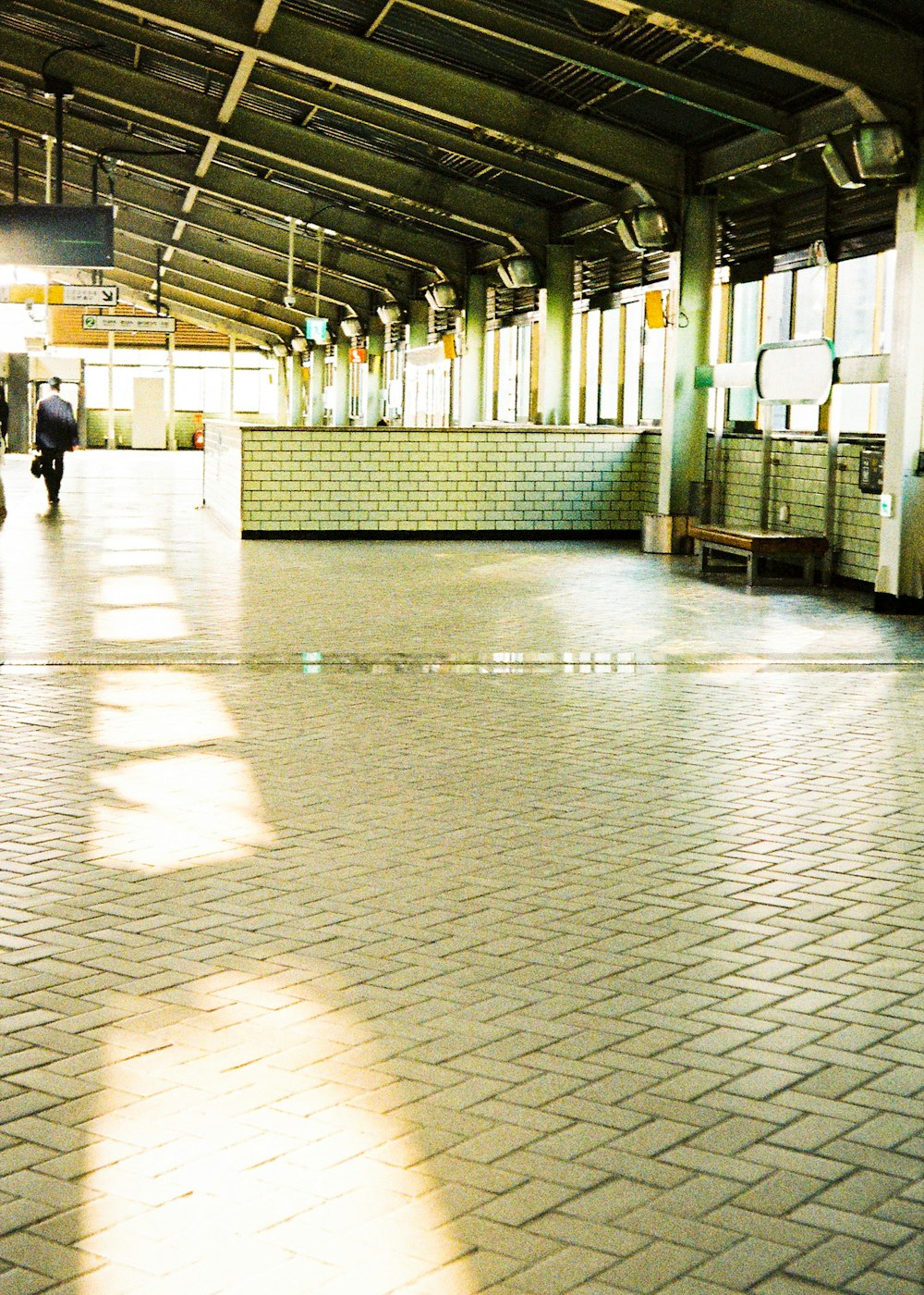 people walking on white and gray floor tiles