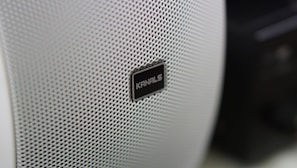 Artistic shot of a premium speaker grille with precise geometric patterns.