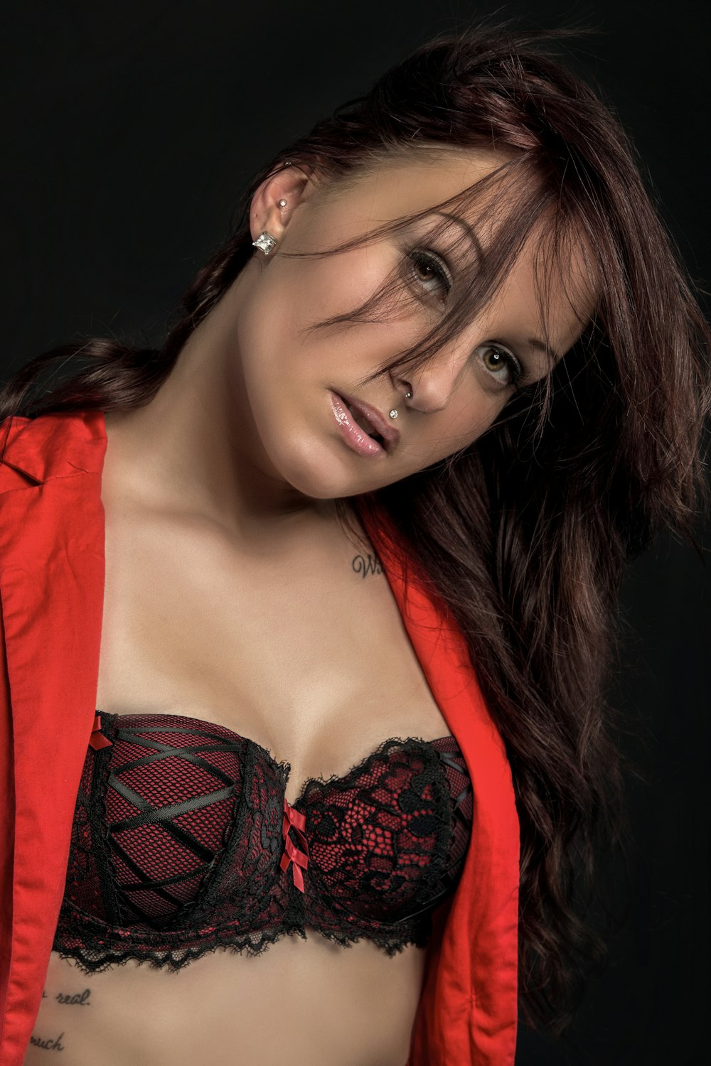 woman in red and black floral brassiere
