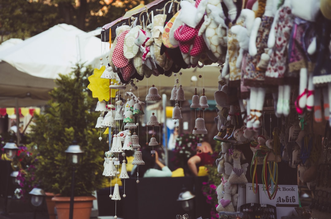 assorted plush toys on black wooden shelf