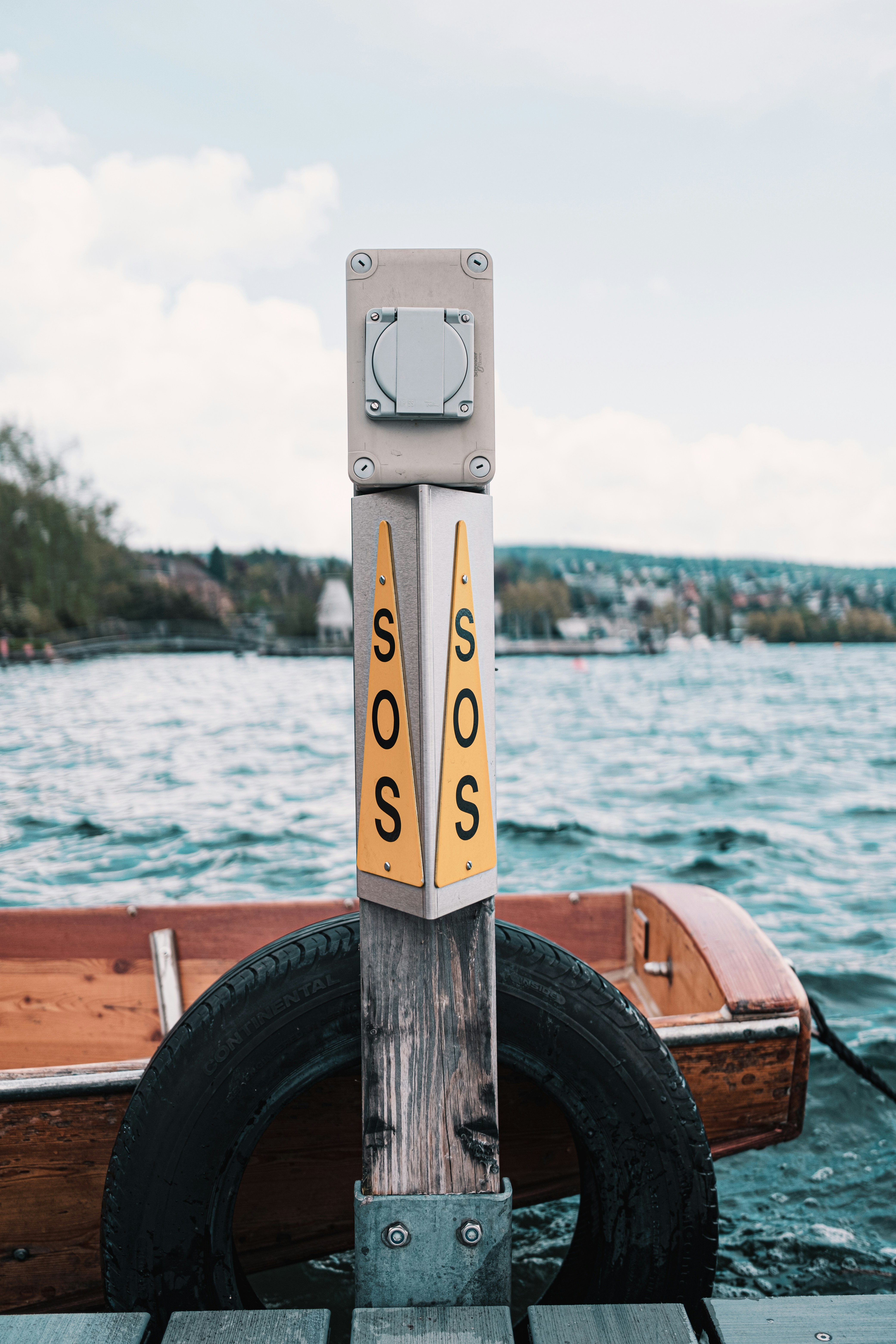 white and black wooden boat on sea during daytime