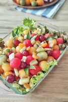 Colorful fruit salad featuring a variety of seasonal fruits.