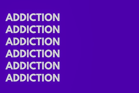 The image features the word 'ADDICTION' repeated six times vertically in bold, white capital letters against a solid purple background.