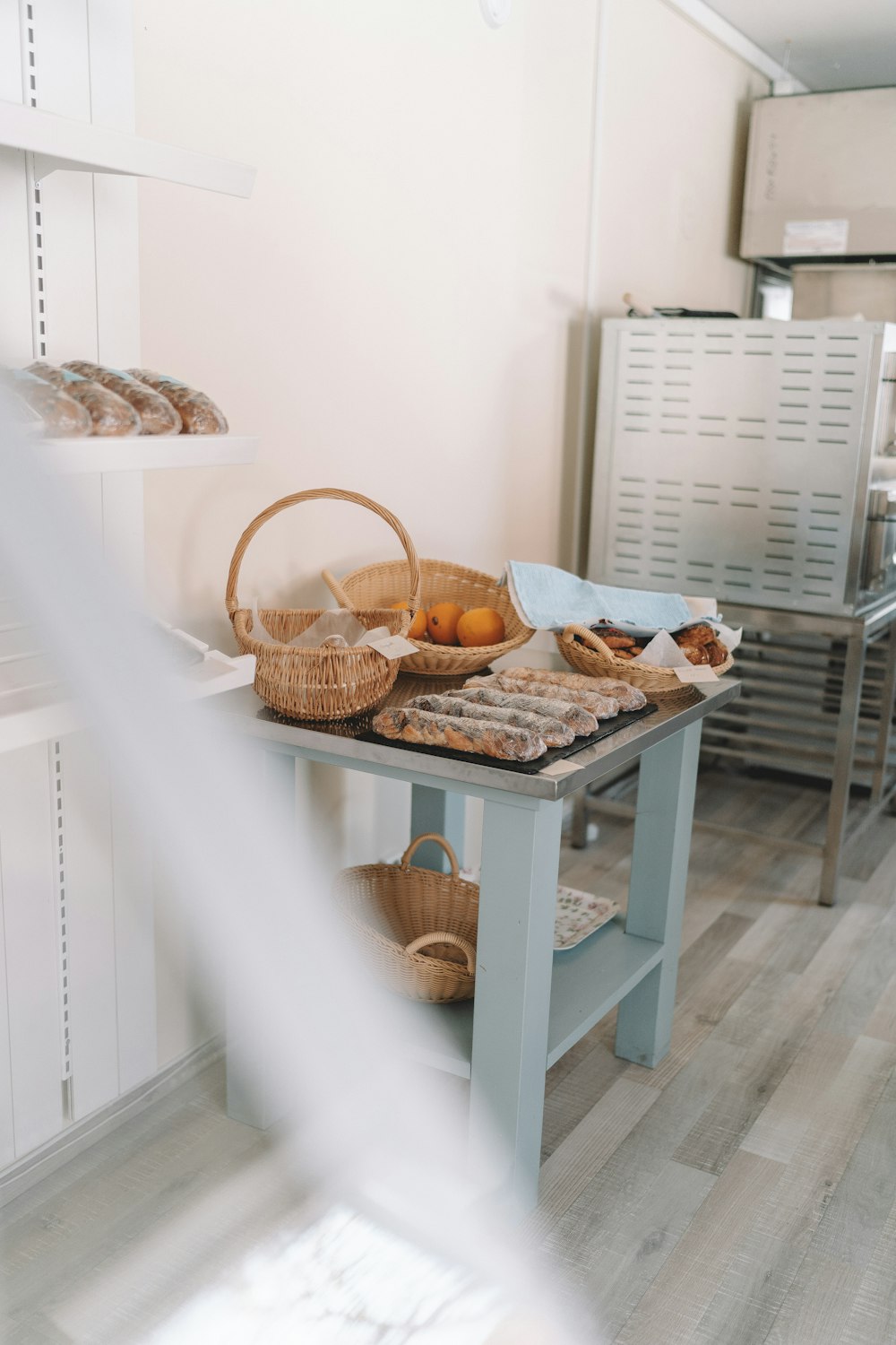 brown wicker basket on white wooden table