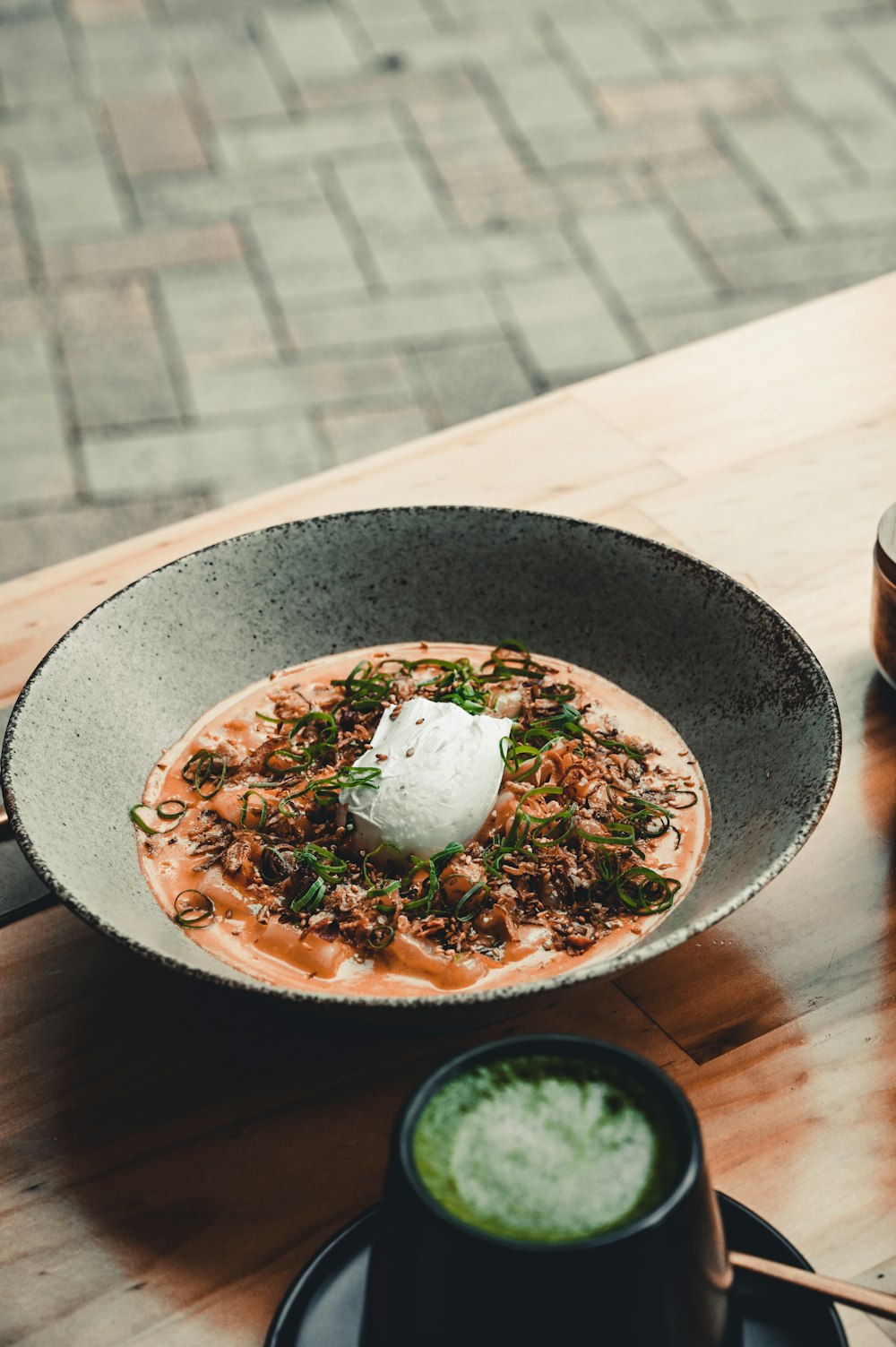 cooked food on black and white ceramic bowl