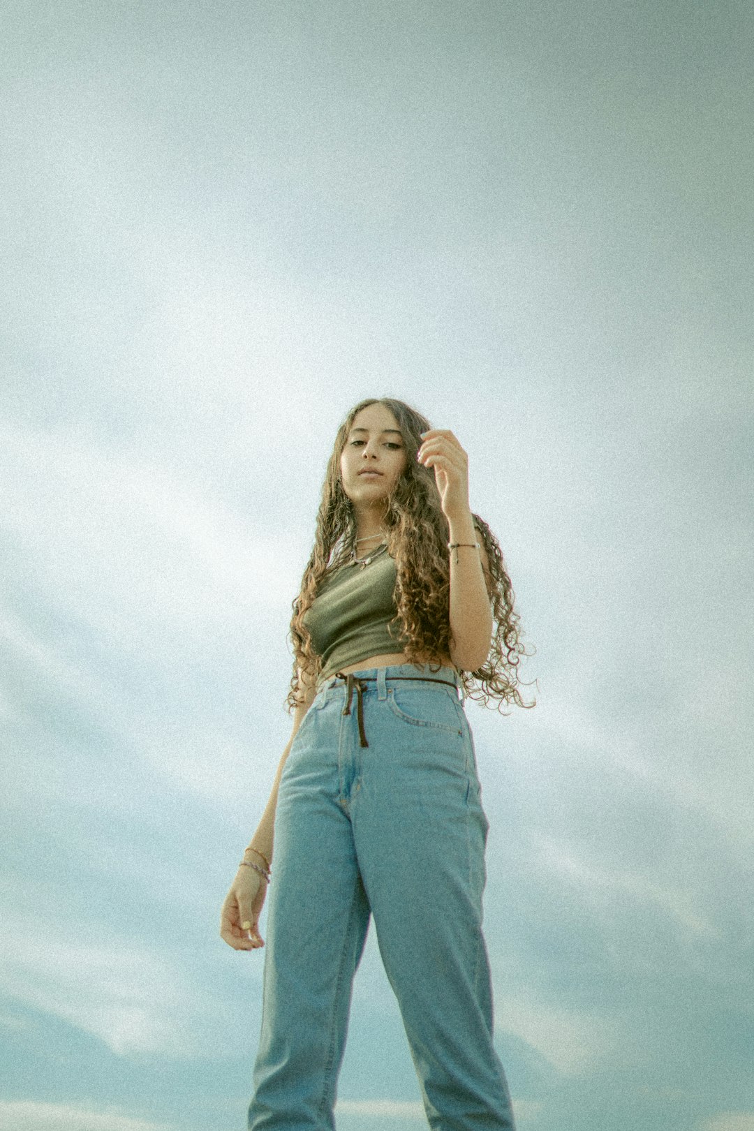 woman in white shirt and blue denim jeans