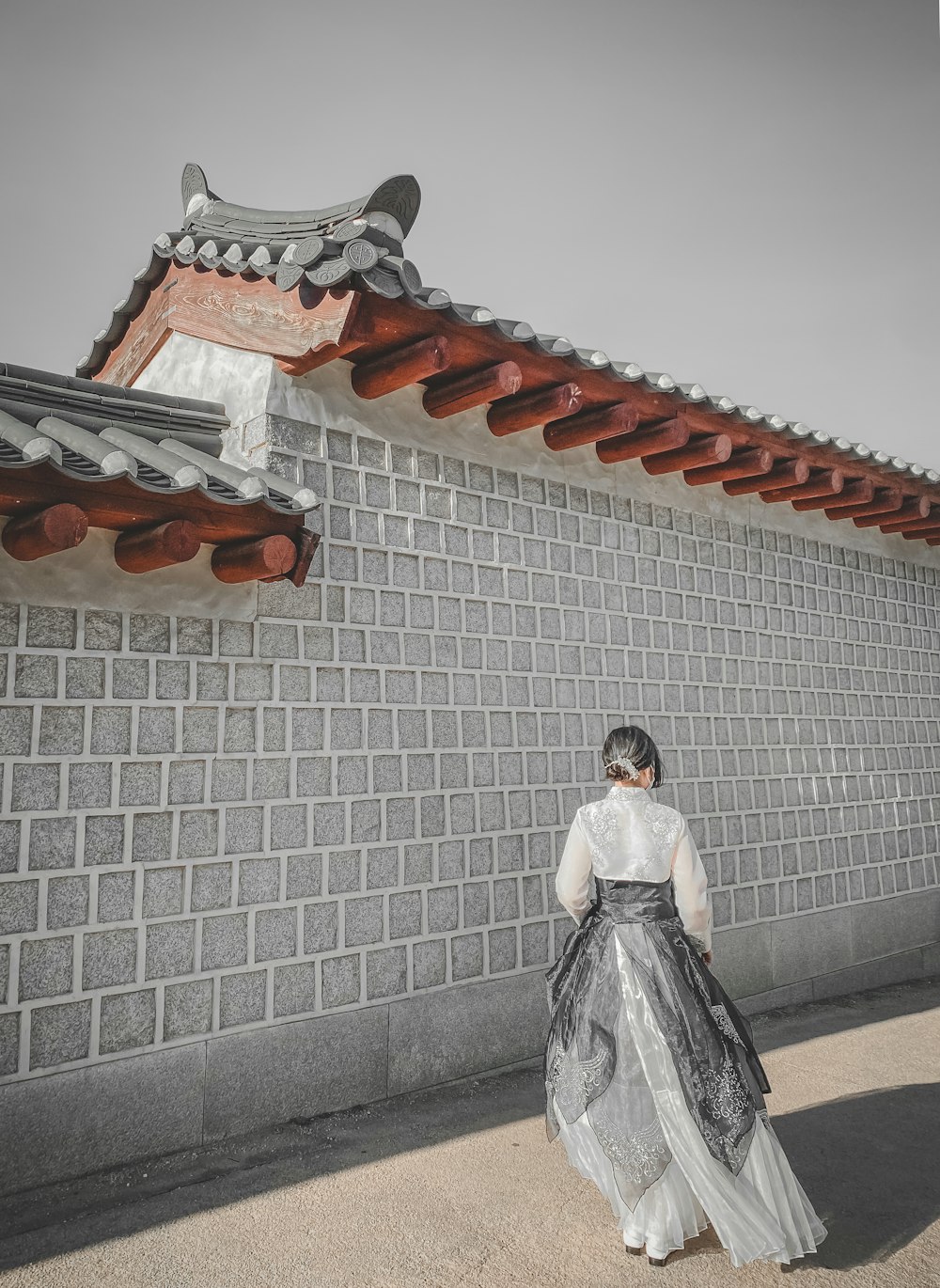 woman in white dress standing on stairs