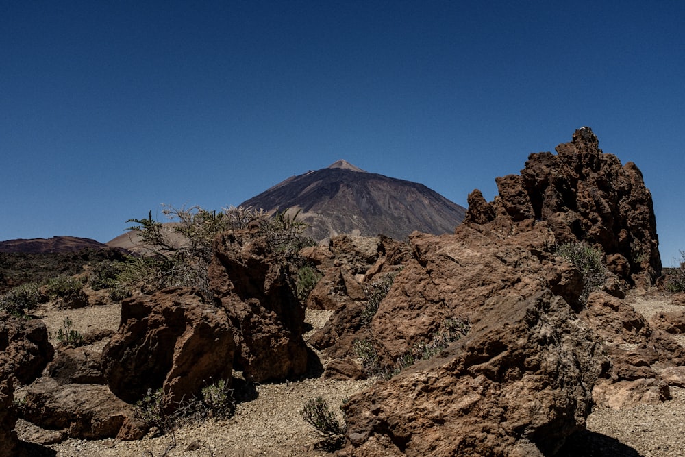 brown rocky mountain under blue sky during daytime